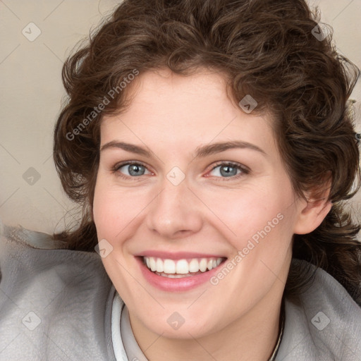 Joyful white young-adult female with medium  brown hair and blue eyes