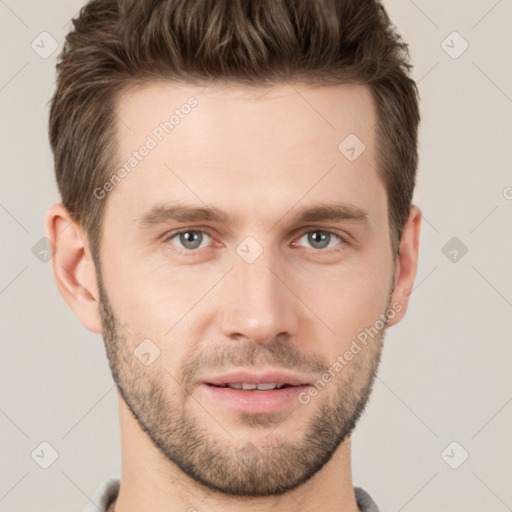 Joyful white young-adult male with short  brown hair and grey eyes