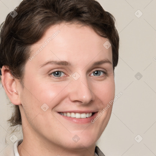 Joyful white young-adult female with short  brown hair and grey eyes