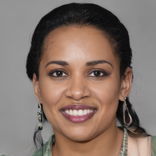 Joyful latino young-adult female with medium  black hair and brown eyes