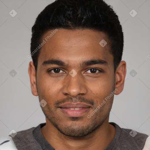 Joyful black young-adult male with short  brown hair and brown eyes