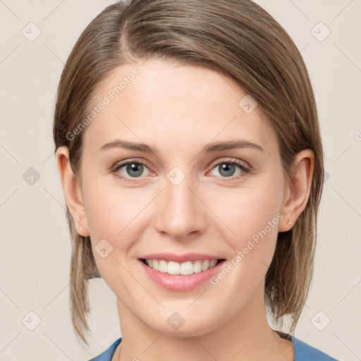 Joyful white young-adult female with medium  brown hair and blue eyes