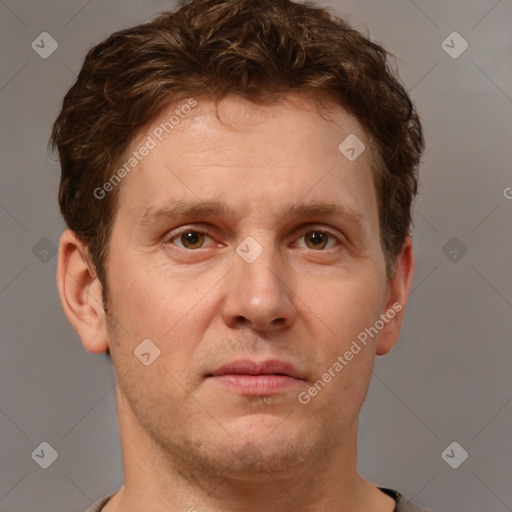 Joyful white adult male with short  brown hair and grey eyes