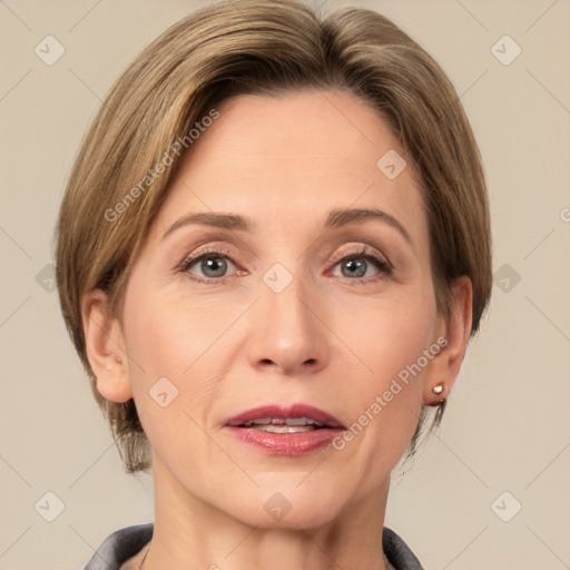 Joyful white adult female with medium  brown hair and grey eyes