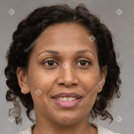 Joyful black adult female with medium  brown hair and brown eyes