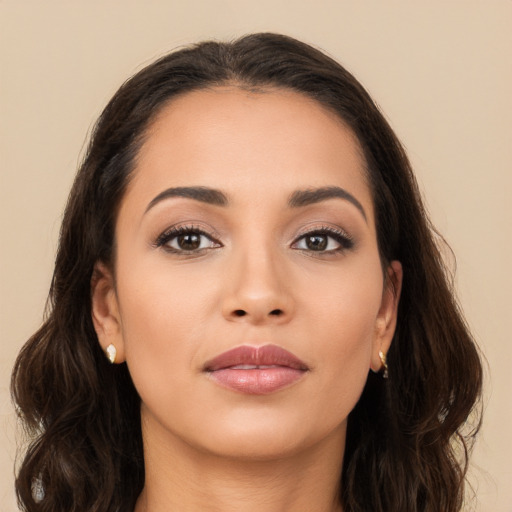 Joyful white young-adult female with long  brown hair and brown eyes