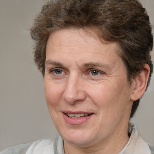 Joyful white middle-aged female with medium  brown hair and brown eyes