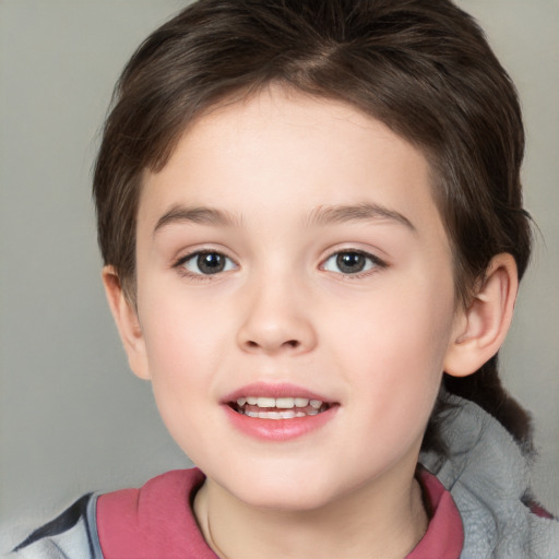 Joyful white child female with short  brown hair and brown eyes