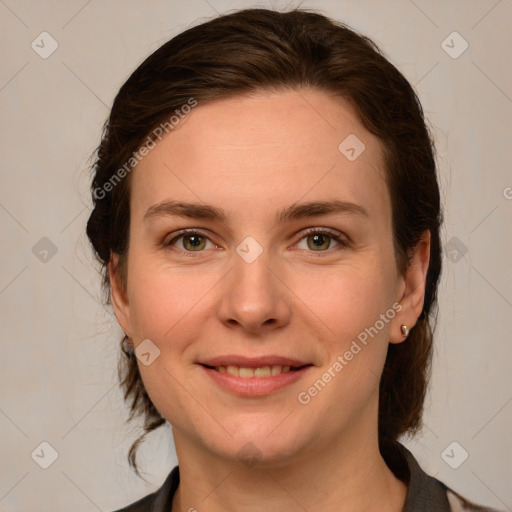 Joyful white young-adult female with medium  brown hair and grey eyes