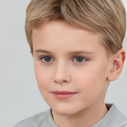 Joyful white child female with short  brown hair and grey eyes