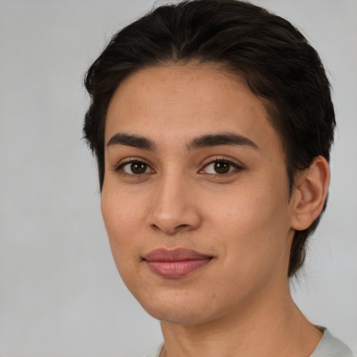 Joyful white young-adult female with medium  brown hair and brown eyes