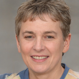 Joyful white adult male with short  brown hair and grey eyes