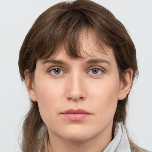 Neutral white young-adult female with medium  brown hair and grey eyes