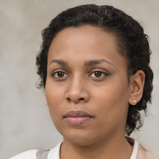 Neutral black young-adult female with short  brown hair and brown eyes