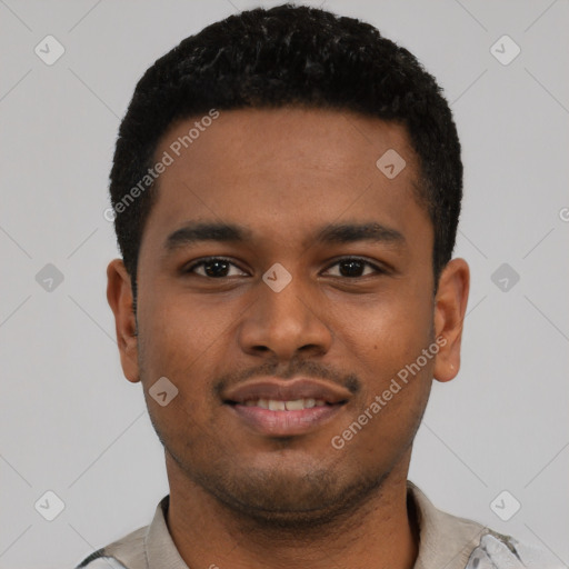 Joyful black young-adult male with short  black hair and brown eyes