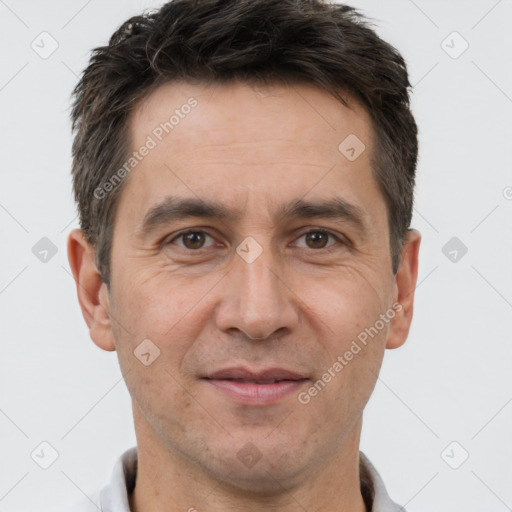 Joyful white adult male with short  brown hair and brown eyes