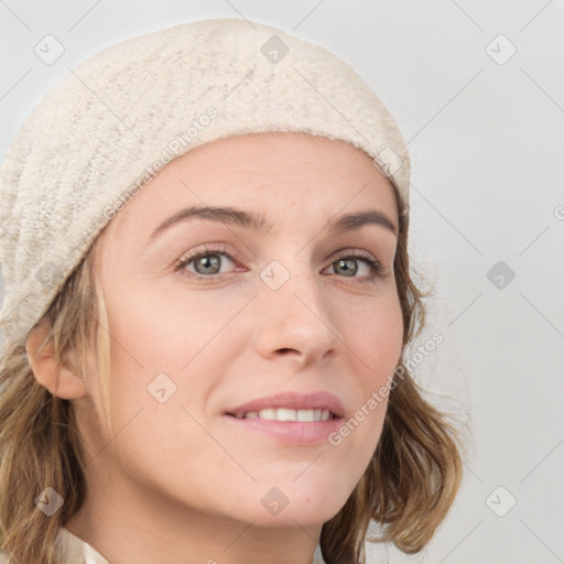 Joyful white young-adult female with medium  brown hair and blue eyes