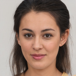 Joyful white young-adult female with medium  brown hair and brown eyes