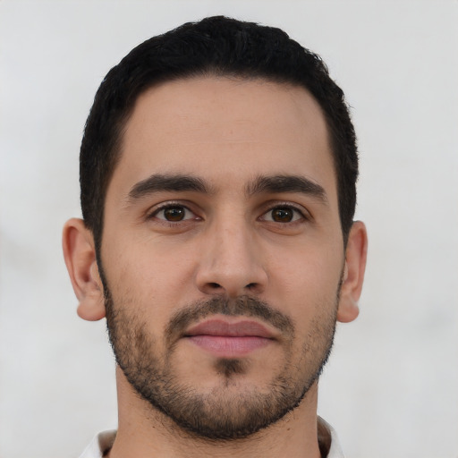 Neutral latino young-adult male with short  black hair and brown eyes