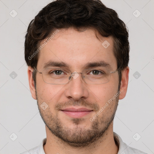 Joyful white young-adult male with short  brown hair and brown eyes