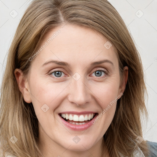 Joyful white young-adult female with long  brown hair and blue eyes