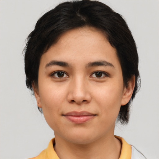 Joyful asian young-adult female with medium  black hair and brown eyes