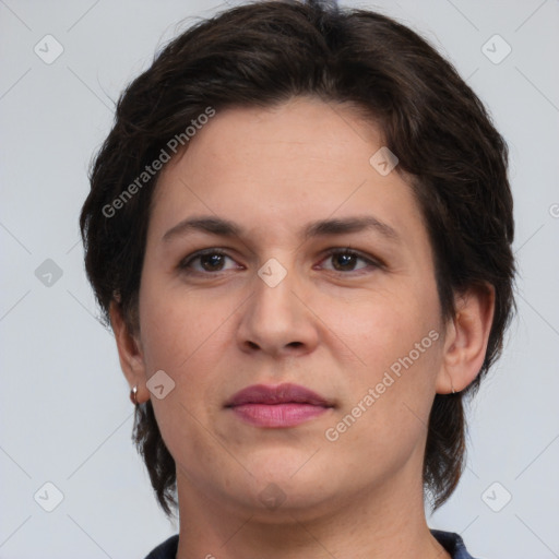 Joyful white adult female with short  brown hair and brown eyes