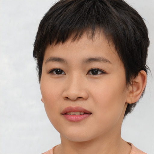 Joyful asian young-adult female with short  brown hair and brown eyes