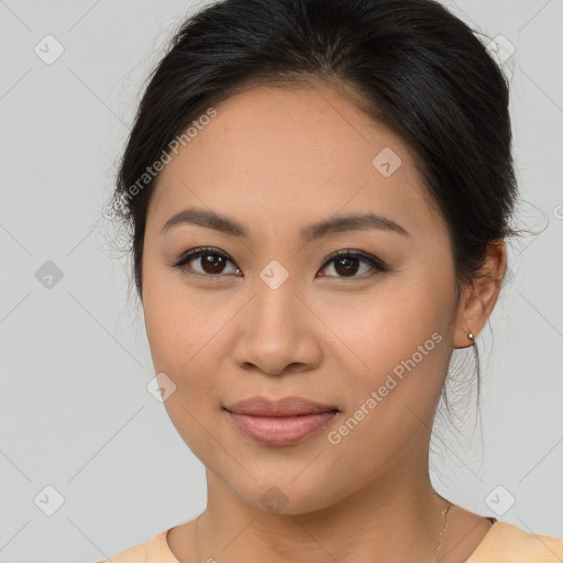 Joyful asian young-adult female with long  brown hair and brown eyes