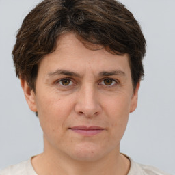 Joyful white adult female with short  brown hair and brown eyes