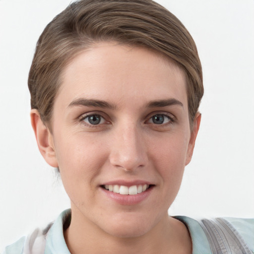 Joyful white young-adult female with short  brown hair and grey eyes