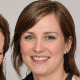 Joyful white young-adult female with medium  brown hair and brown eyes