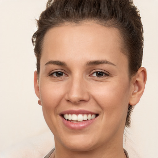 Joyful white young-adult female with short  brown hair and brown eyes