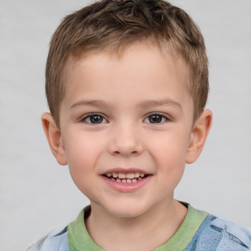 Joyful white child male with short  brown hair and brown eyes