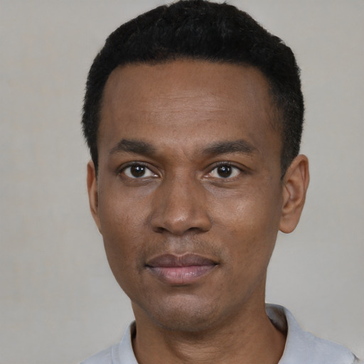 Neutral black young-adult male with short  black hair and brown eyes