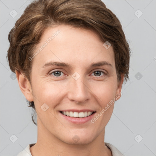 Joyful white young-adult female with short  brown hair and grey eyes