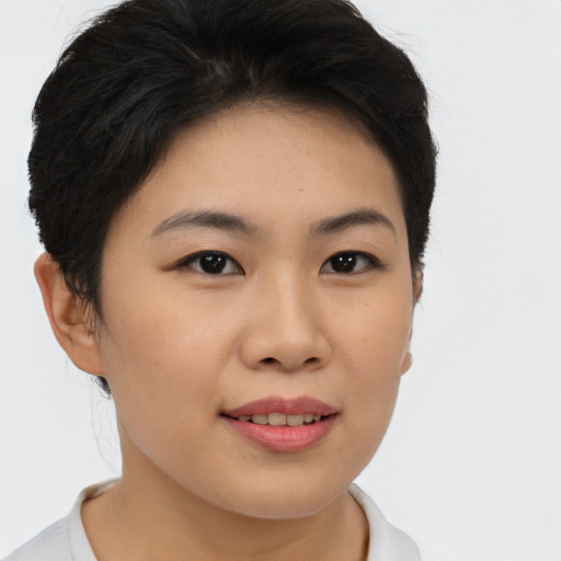 Joyful asian young-adult female with short  brown hair and brown eyes