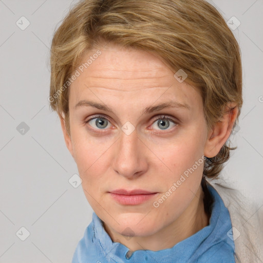 Joyful white young-adult female with medium  brown hair and blue eyes