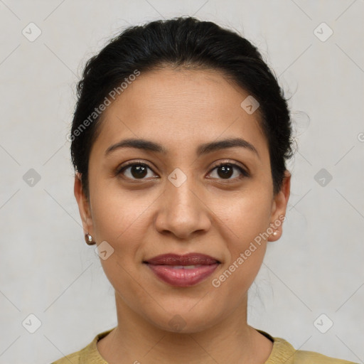 Joyful latino young-adult female with short  brown hair and brown eyes