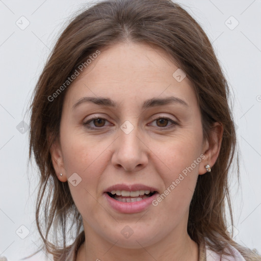 Joyful white adult female with medium  brown hair and grey eyes