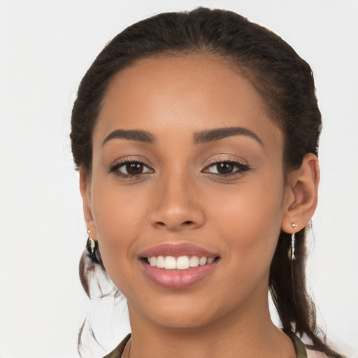 Joyful white young-adult female with long  brown hair and brown eyes