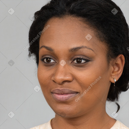 Joyful black young-adult female with medium  black hair and brown eyes