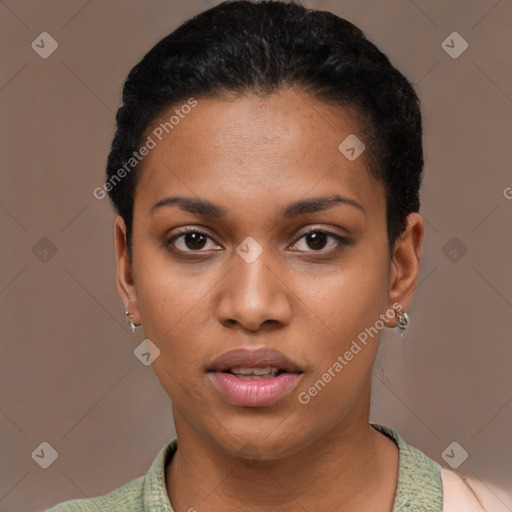 Joyful black young-adult female with short  black hair and brown eyes