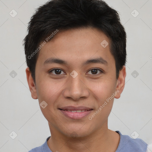 Joyful asian young-adult male with short  brown hair and brown eyes