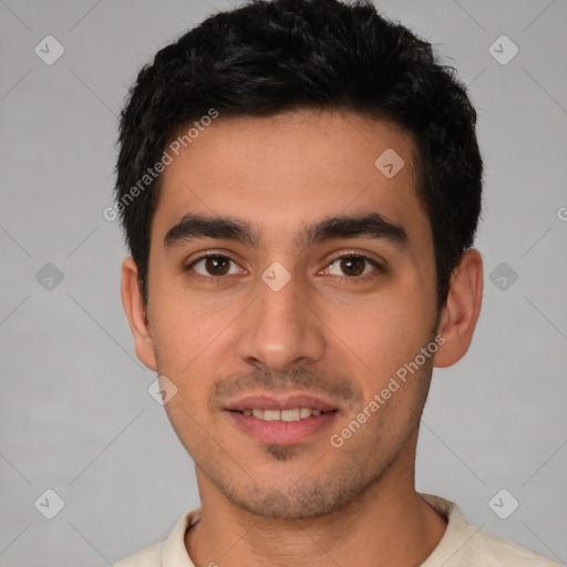 Joyful white young-adult male with short  black hair and brown eyes