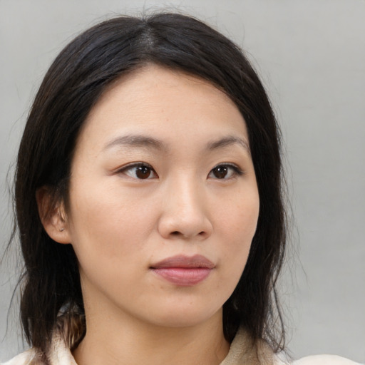 Neutral asian young-adult female with medium  brown hair and brown eyes