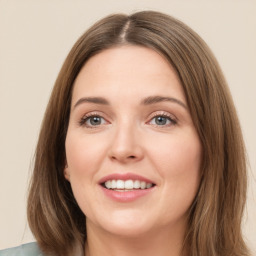 Joyful white young-adult female with long  brown hair and green eyes