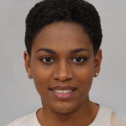 Joyful black young-adult female with short  brown hair and brown eyes