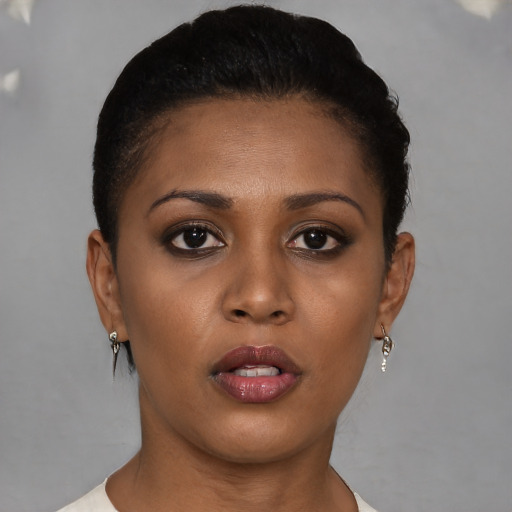 Neutral black young-adult female with short  brown hair and brown eyes