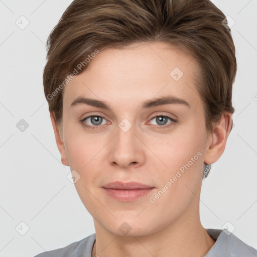 Joyful white young-adult female with short  brown hair and grey eyes